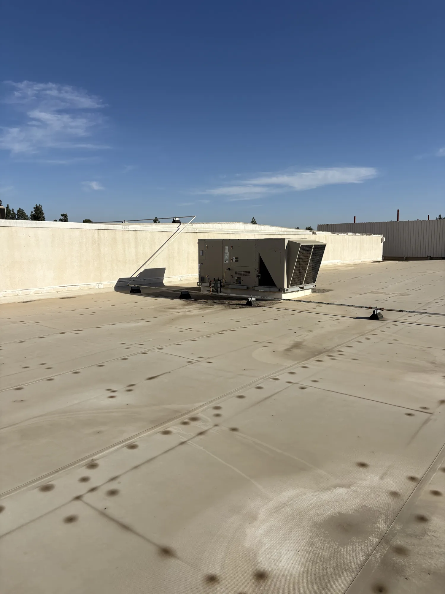 Existing TPO membrane and rooftop equipment in Bakersfield